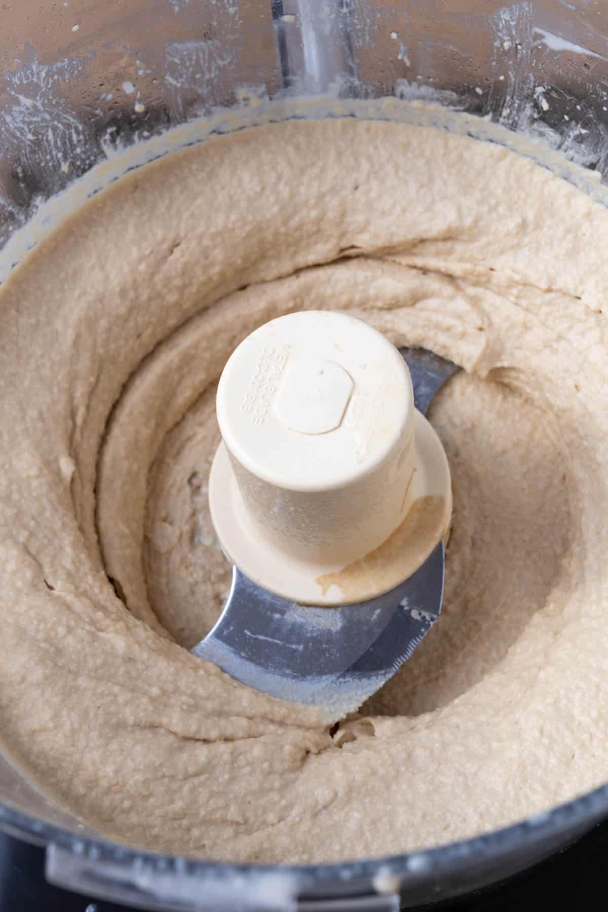 Making hummus in a food processor.
