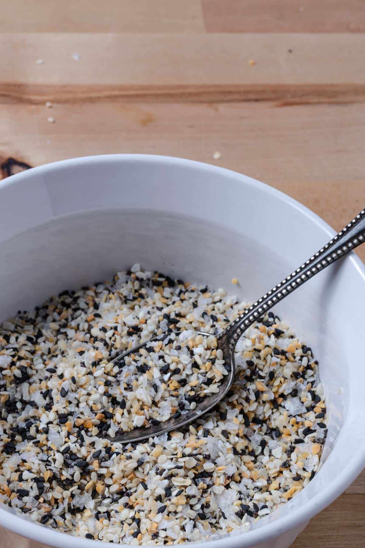 Everything bagel seasoning in a white ramekin.