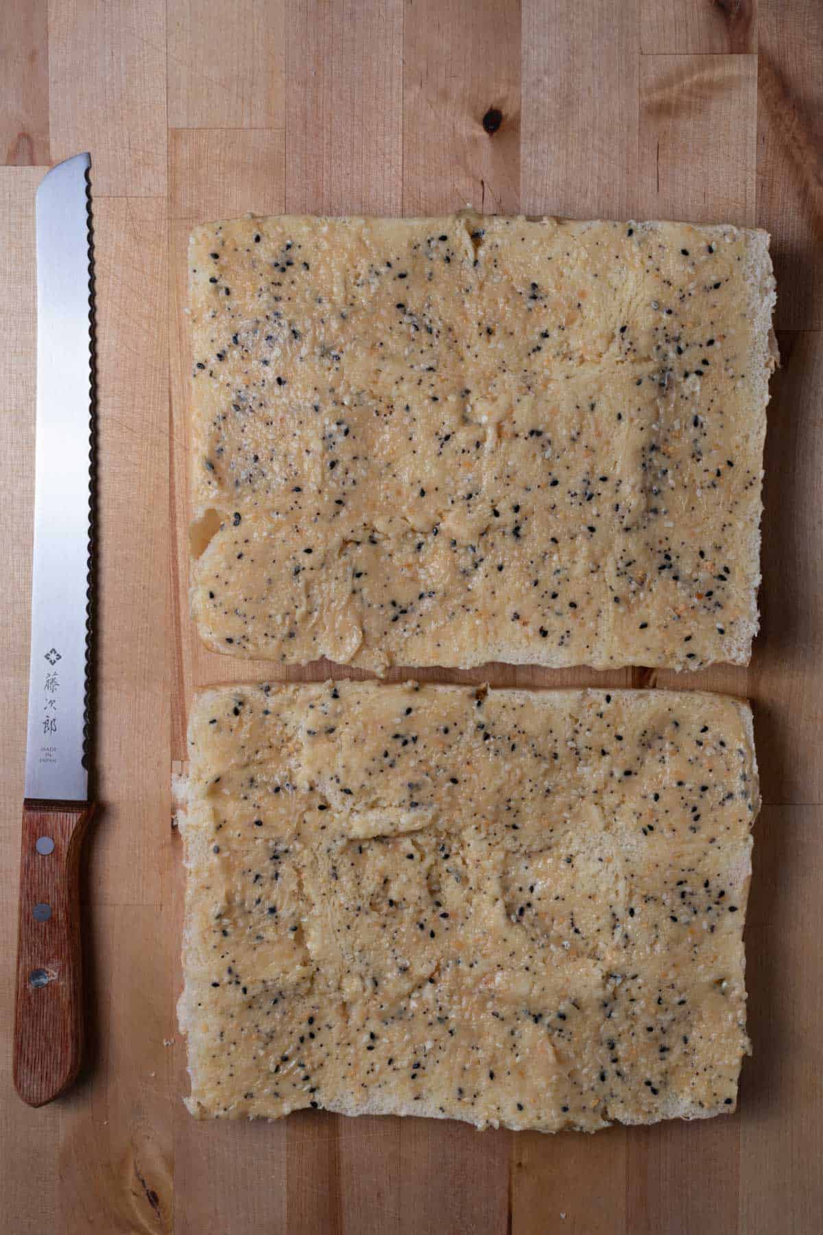 Hawaiian rolls spread with honey-dijon butter and everything bagel seasoning.