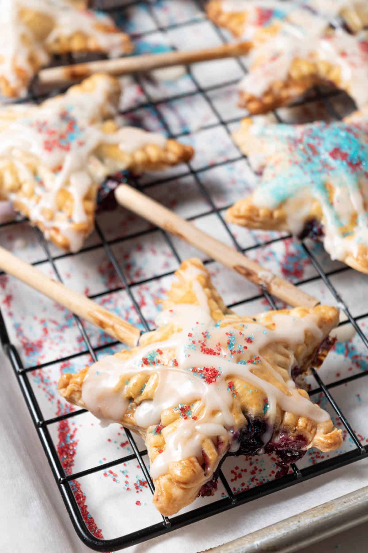 Star shaped blueberry pie on a stick.