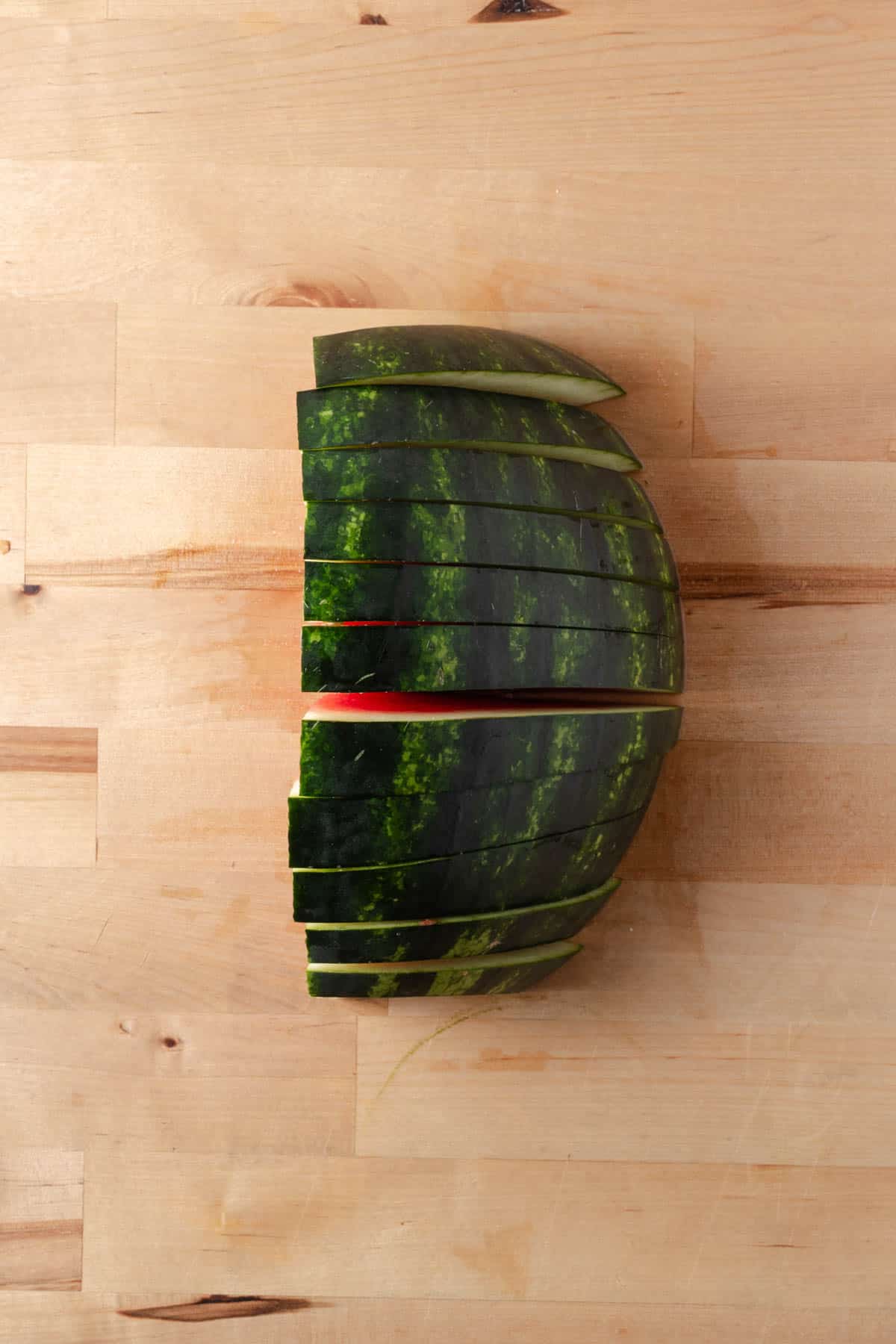 A quarter of a watermelon sliced.