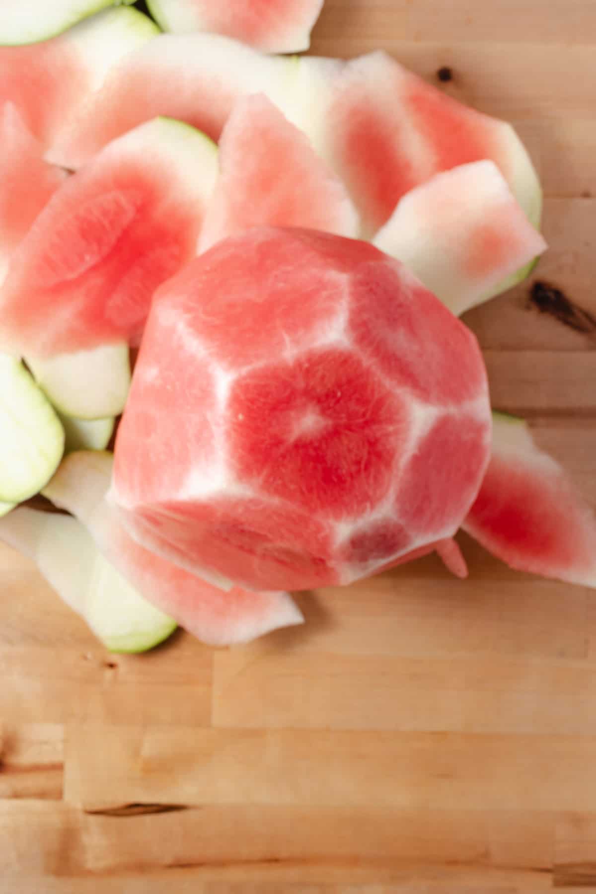 A watermelon with the rind cut off.