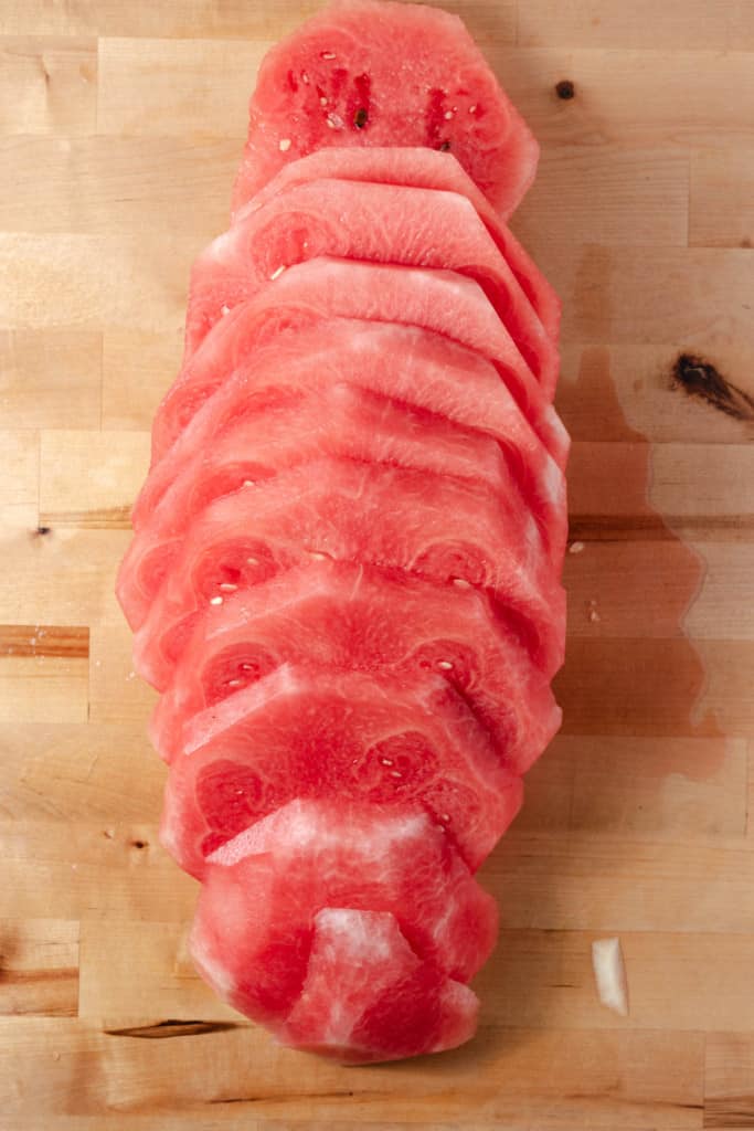 A watermelon sliced into rounds.