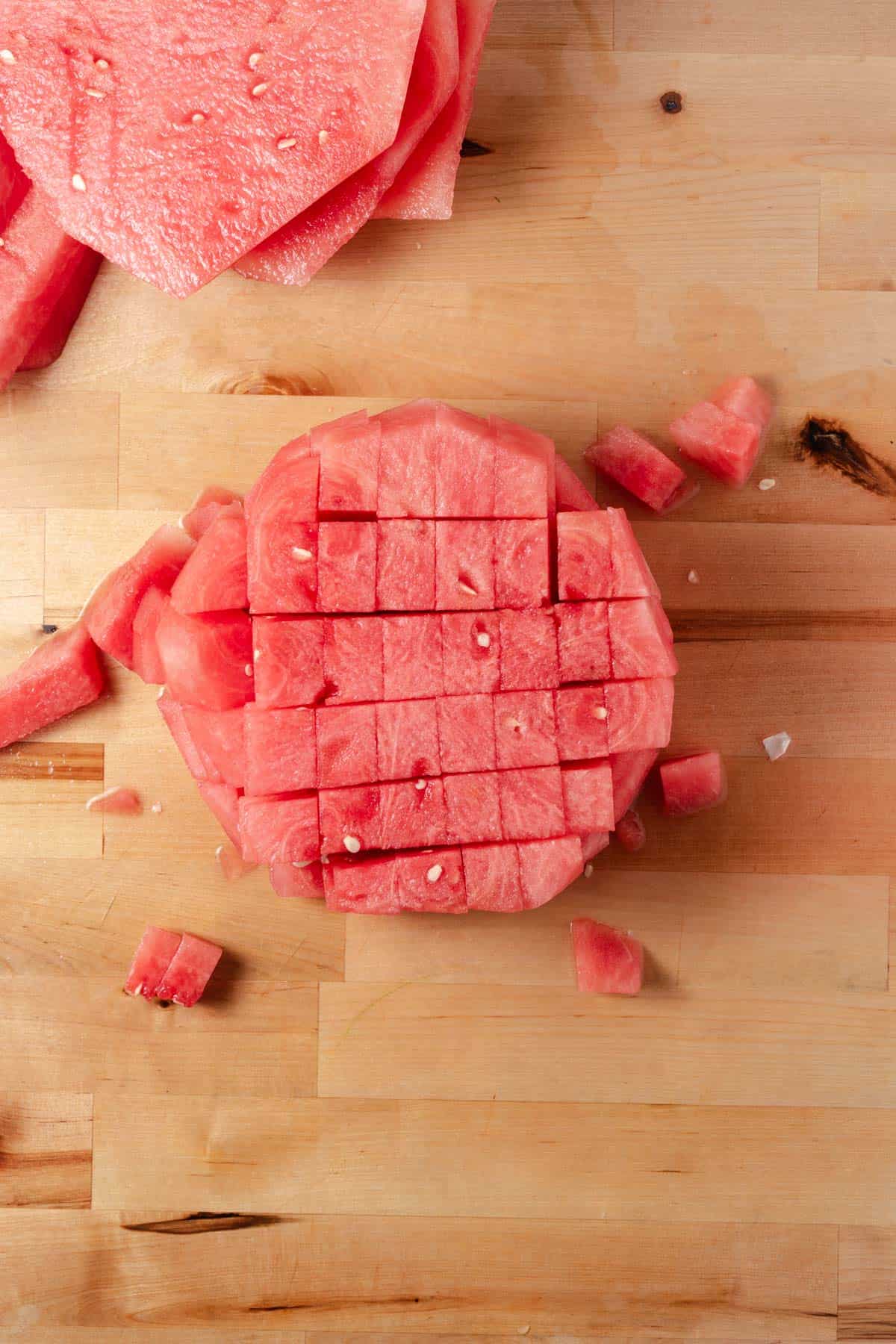 Cutting a watermelon into cubes.