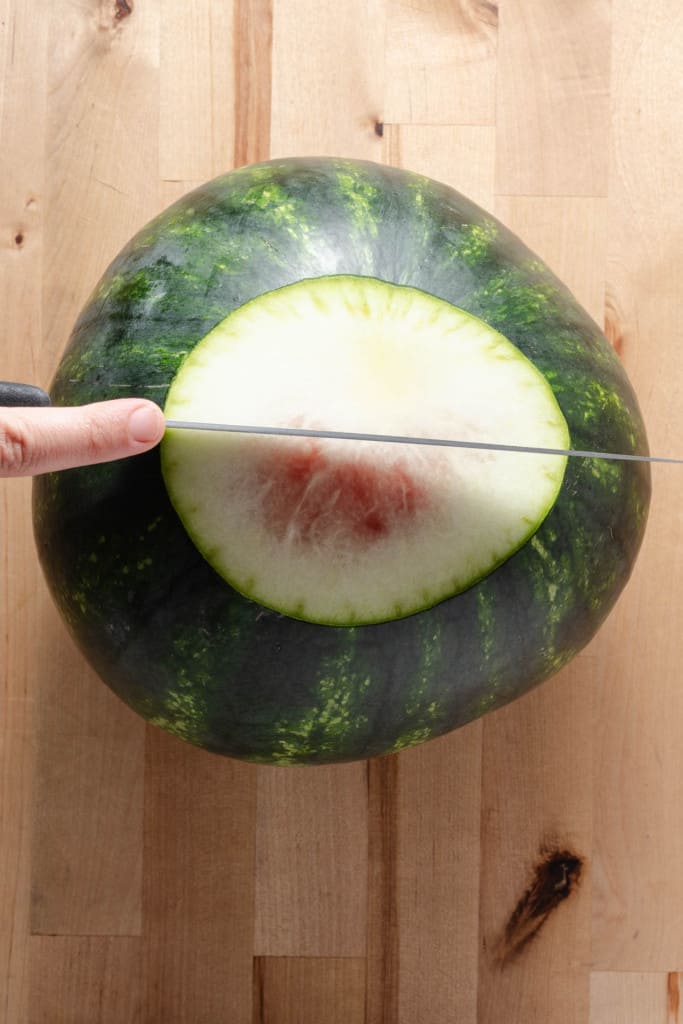 Cutting a watermelon.