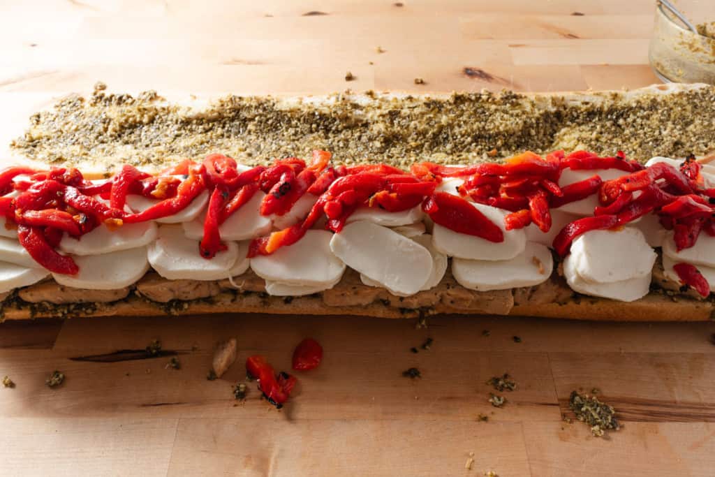 Assembling a pressed Italian sandwich.