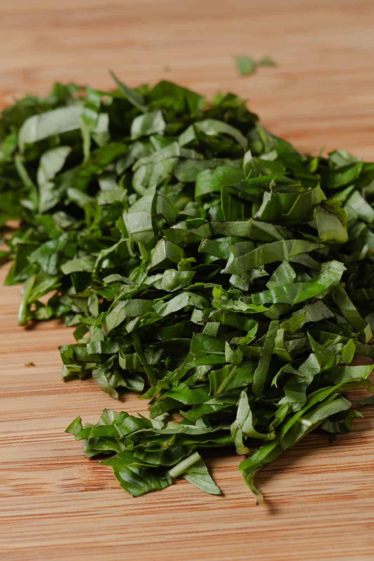 A pile of basil chiffonade.