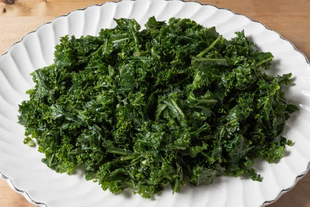 A white platter of massaged kale.