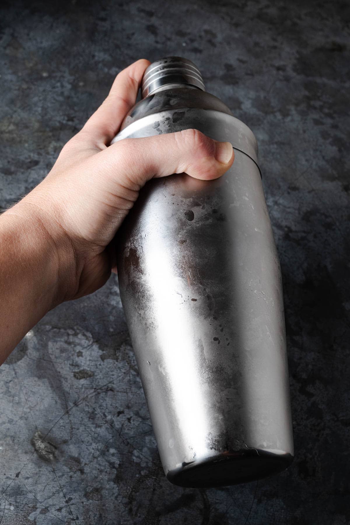 Shaking a cocktail shaker.