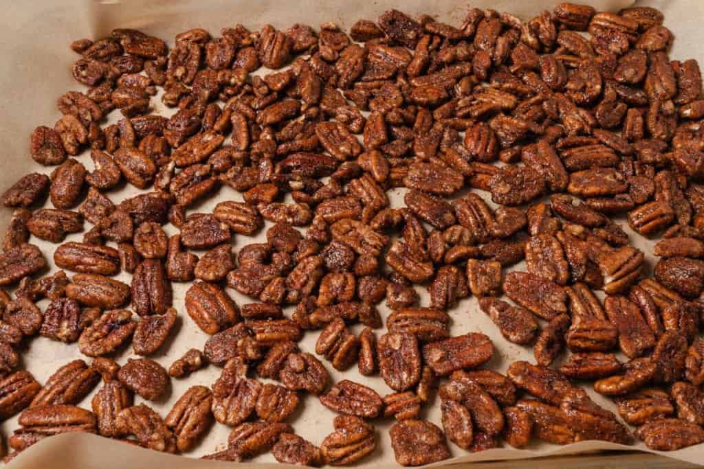 Candied pecans on a sheet pan.
