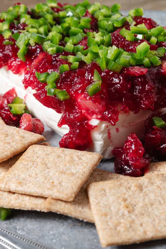 A quick holiday appetizer made with cream cheese, cranberries, and jalapenos, with crackers.