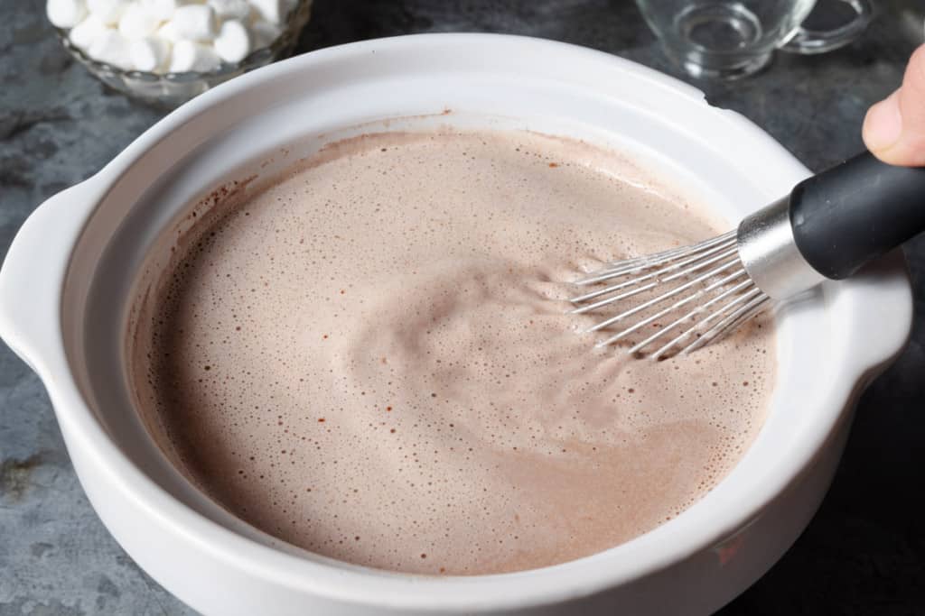 A crockpot of homemade rich and creamy hot chocolate.