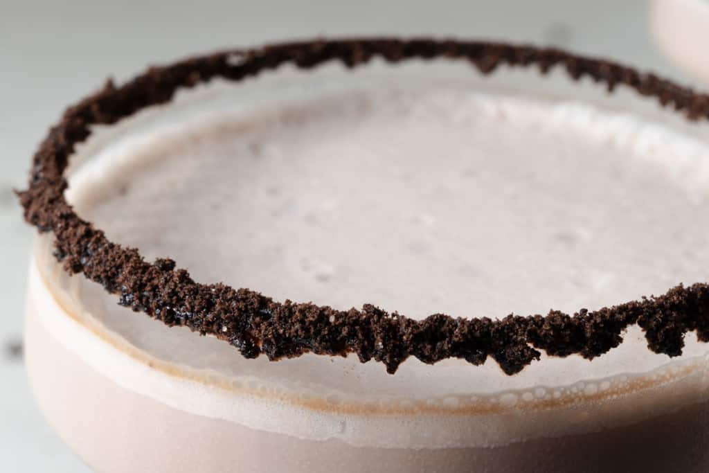 A chocolate martini with a chocolate rim.