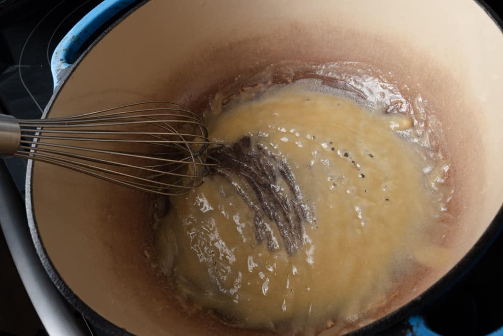 Whisking a roux.