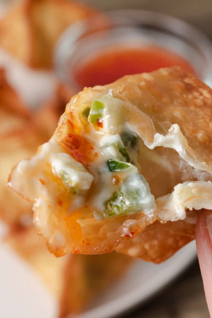 The middle of a fried jalapeno and cream cheese wonton.