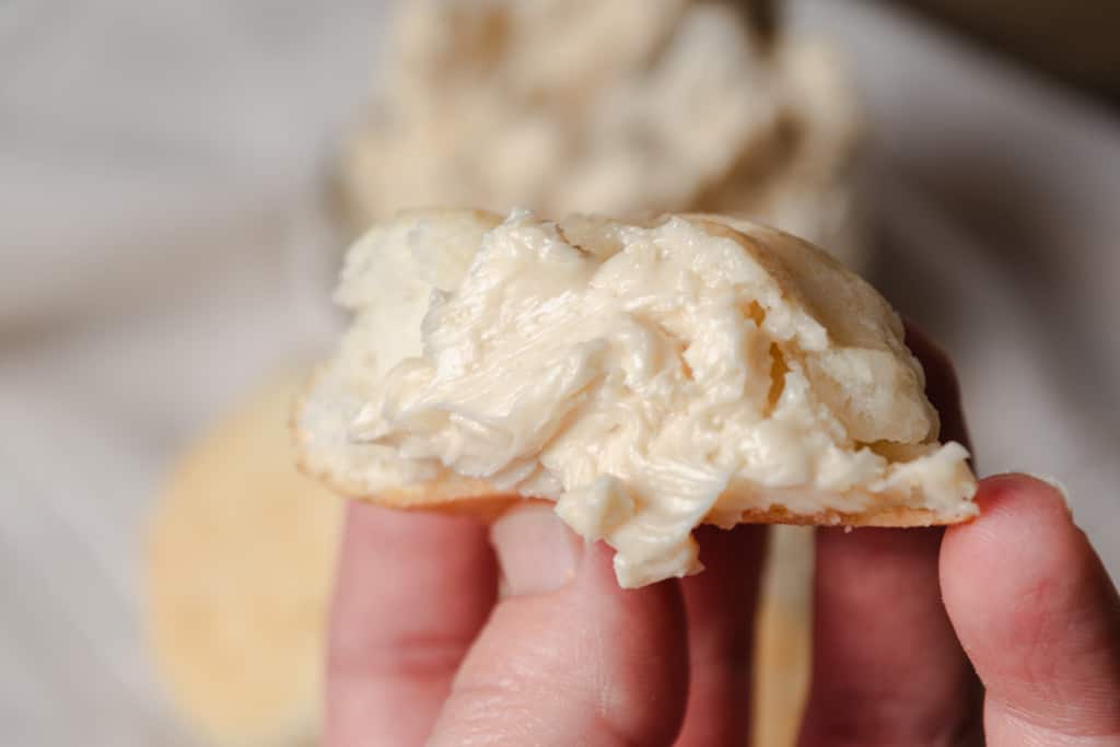 Whipped honey butter spread on a biscuit.