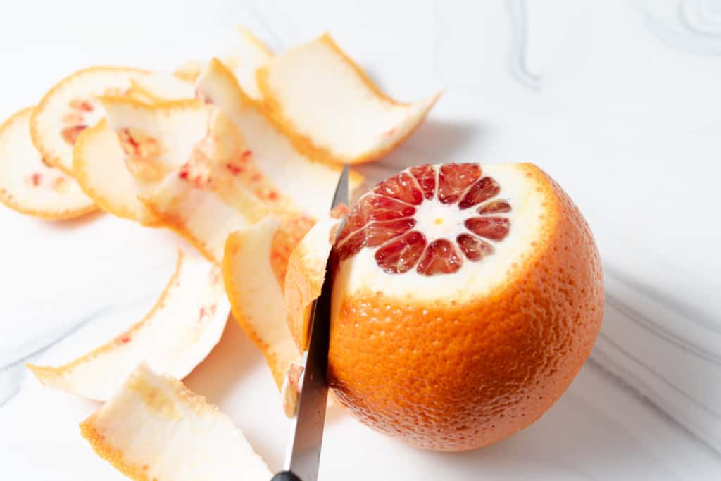 Cutting a blood orange to make supremes.