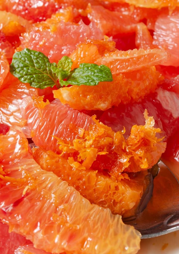A citrus salad made from supremes of grapefruit, blood oranges, cara cara oranges, mandarin oranges, honey, and mint.
