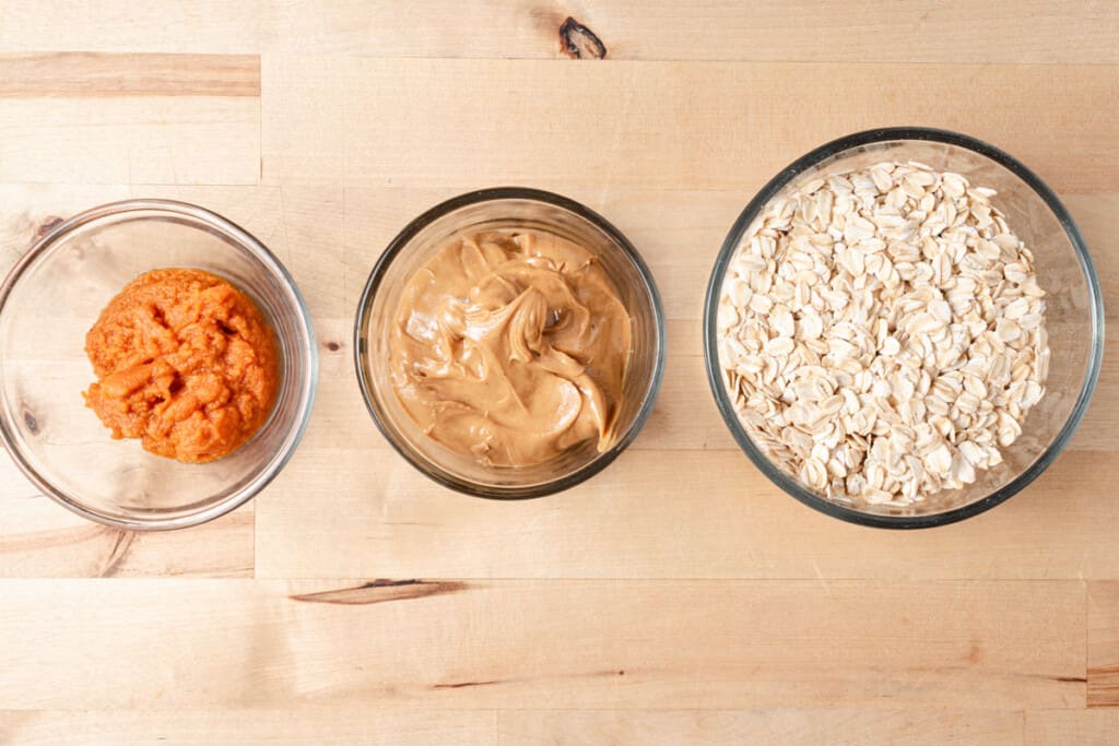 Bowls of oats, pumpkin, and peanut butter.