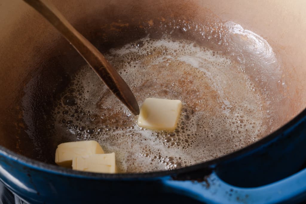 Melting butter in a Dutch oven.