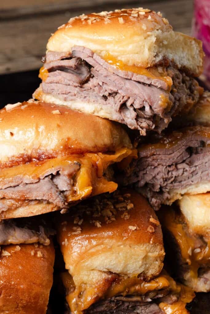 A pile of roast beef and cheese sliders for game day.