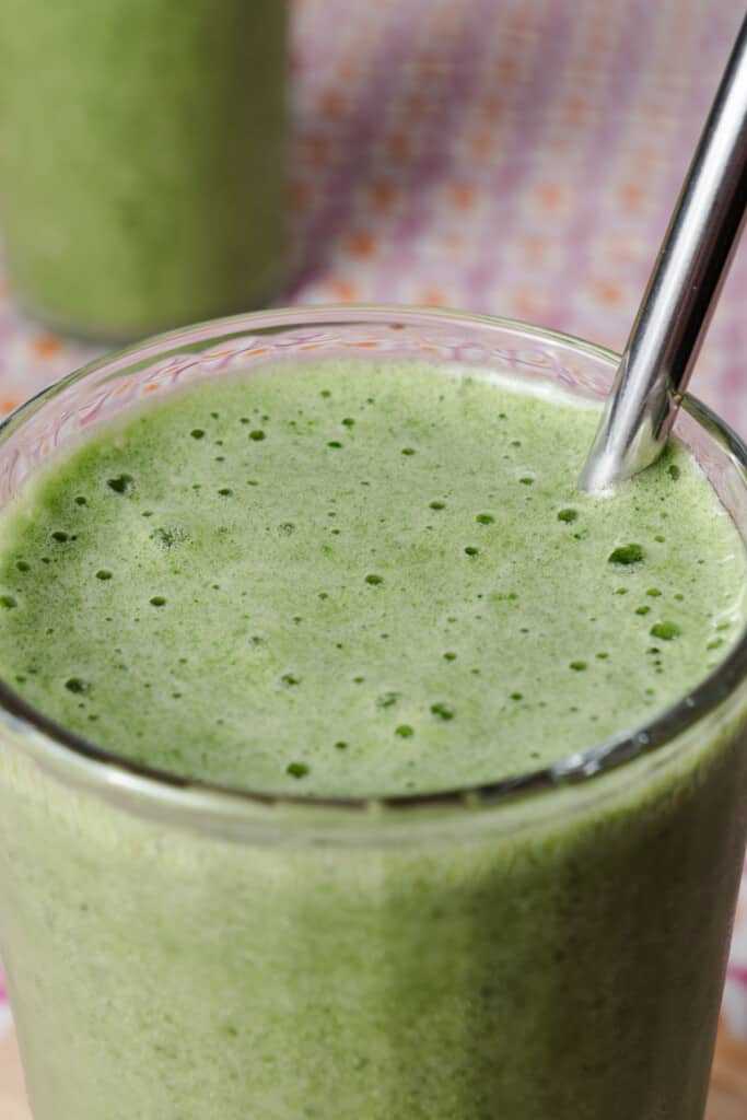 A homemade tropical island green smoothie in a glass.