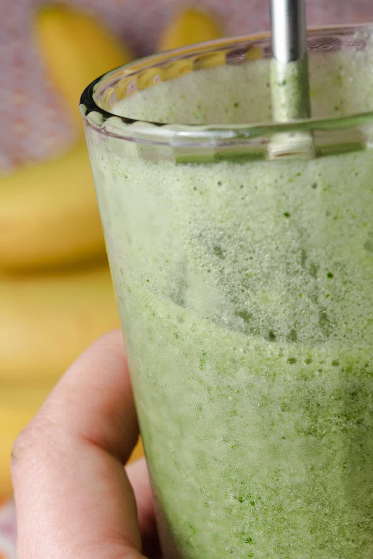 Drinking a homemade tropical island green smoothie.