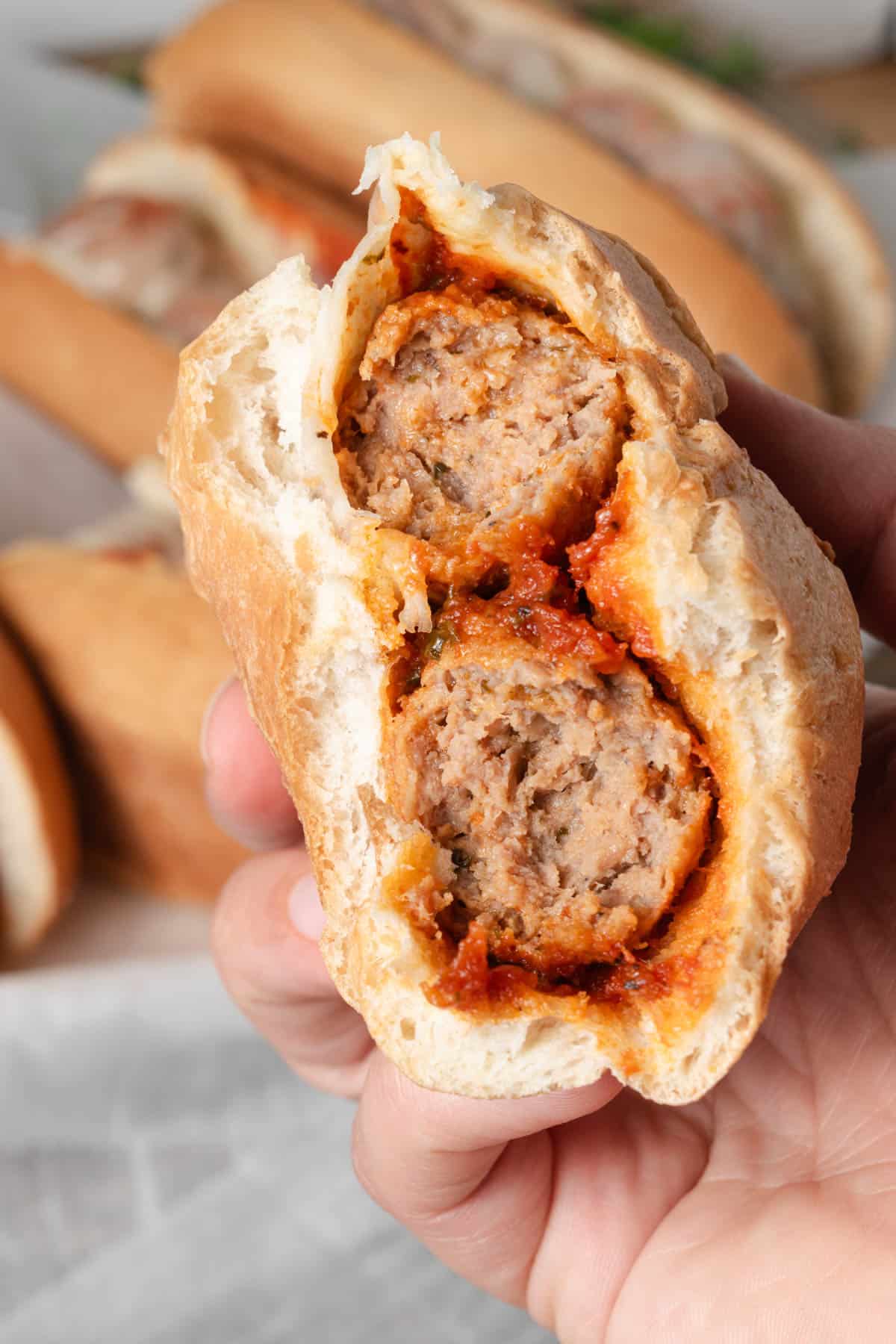 A bite out of a homemade meatball sub.