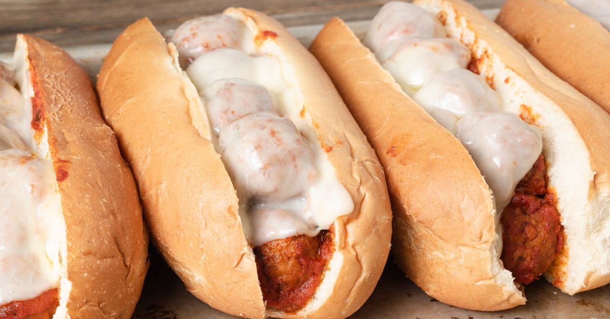A meatball sub sandwich with melted cheese.