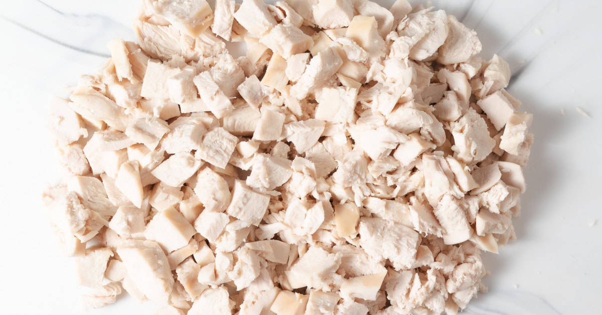 Juicy poached chicken breast diced into chunks.