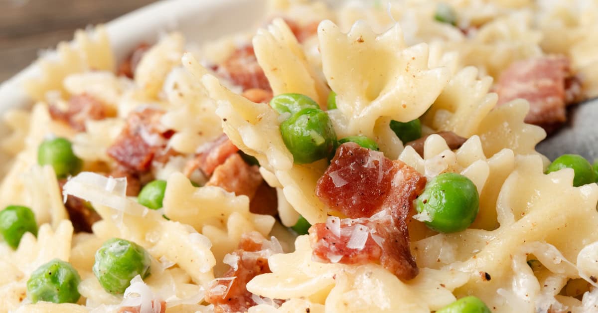 Bowtie pasta with peas, bacon, and parmesan cheese.
