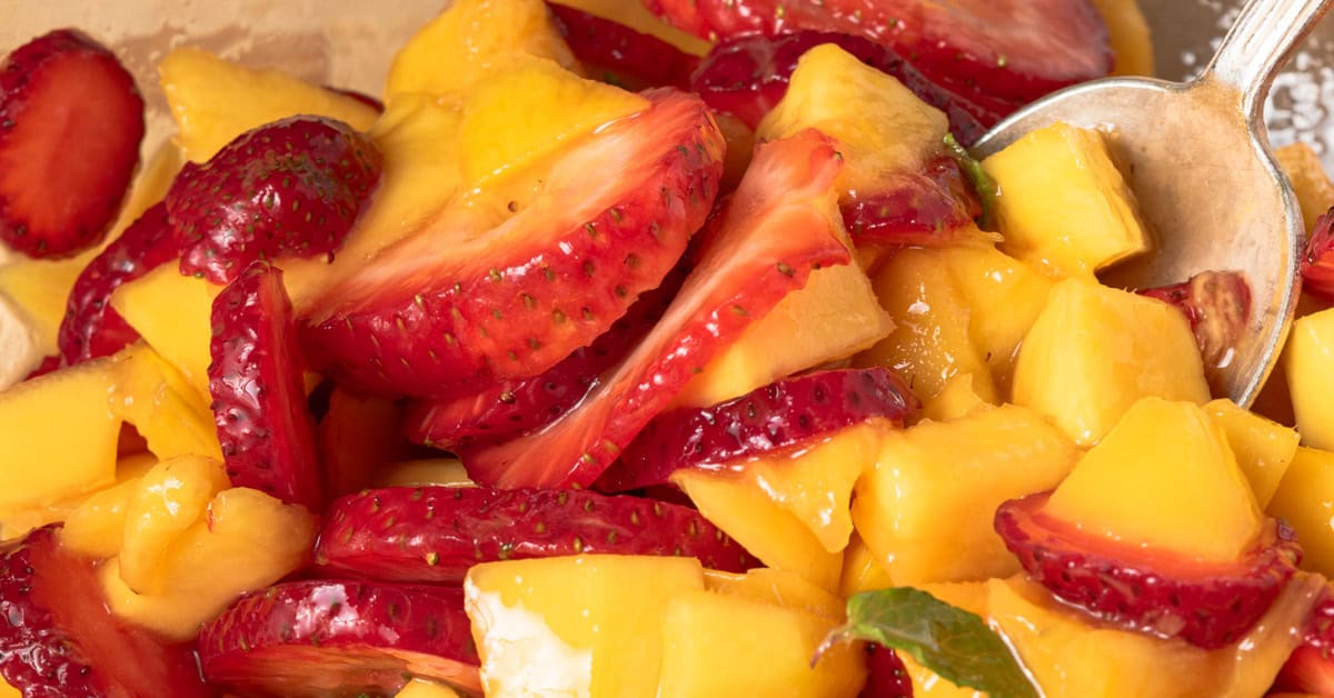 Sliced strawberries and mangoes.