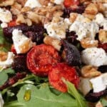 Roasted beet and carrot salad on a platter.