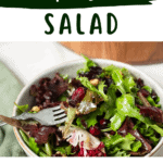 A pin depicting cranberry and walnut green salad.