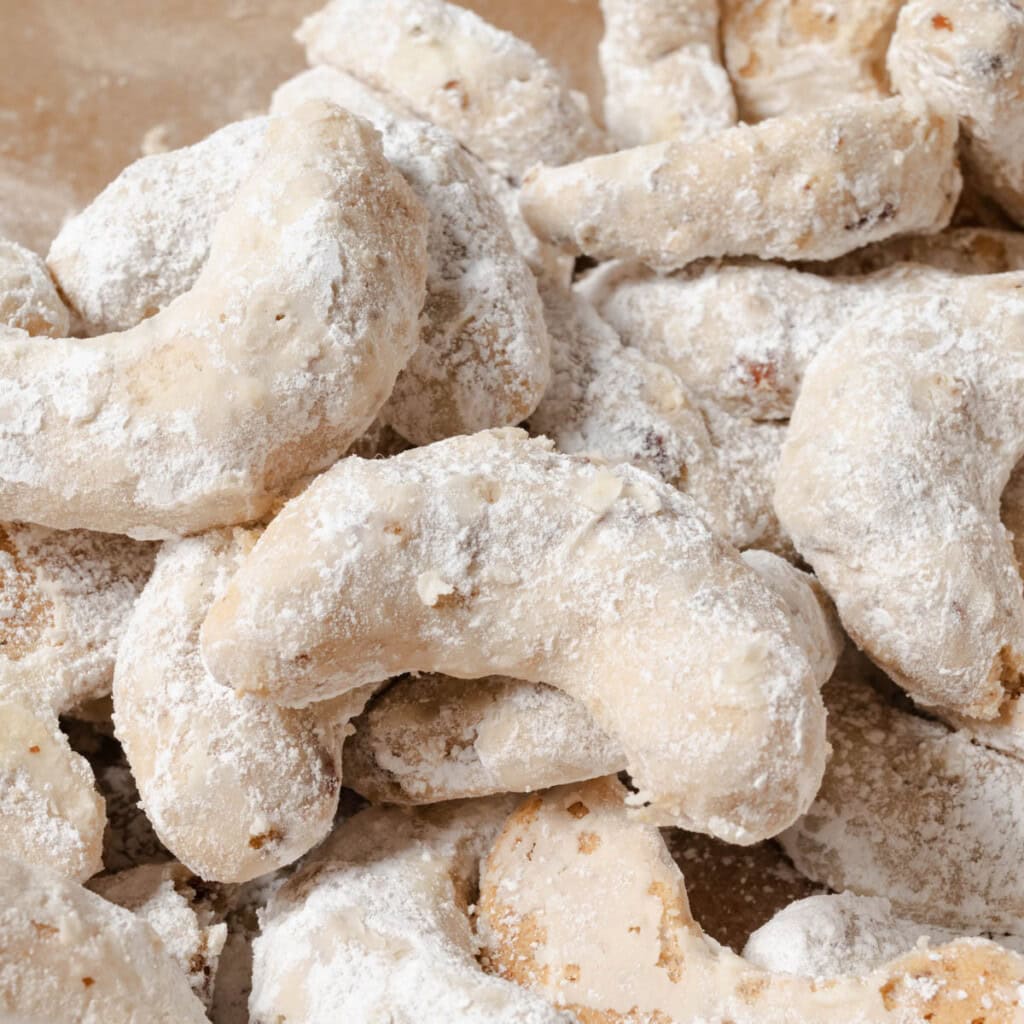 Powdered sugar coated pecan crescent cookies.