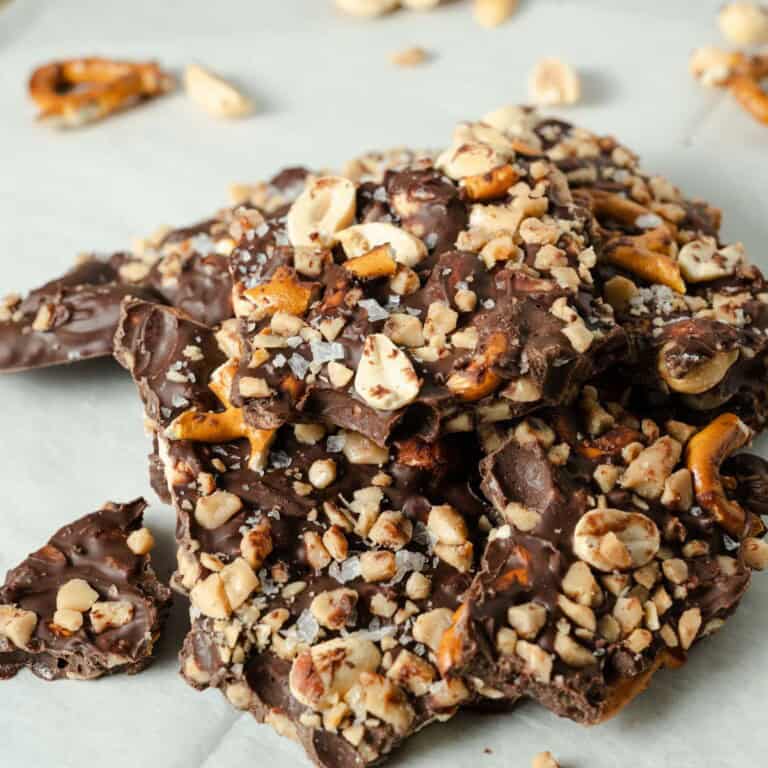 Pieces of chocolate bark with peanuts, pretzels, toffee bits, and sea salt.