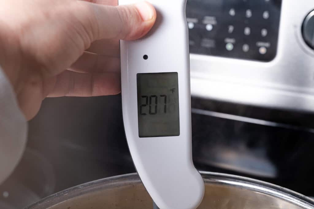A meat therometer that reads 207 degrees.