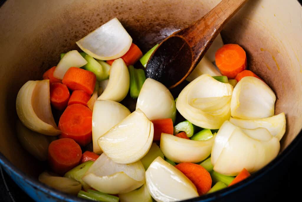 Sauteing vegetables until golden.