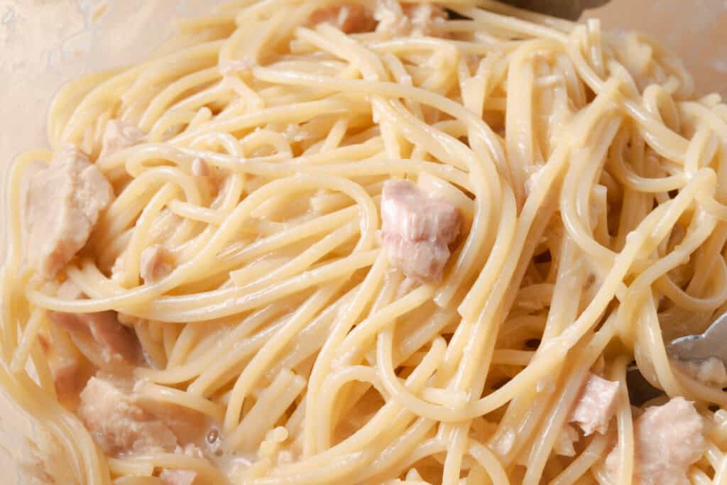 Spaghetti al tonno e burro after tossing in pasta water.