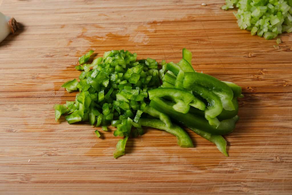 Finely diced bell pepper on a cutting board.