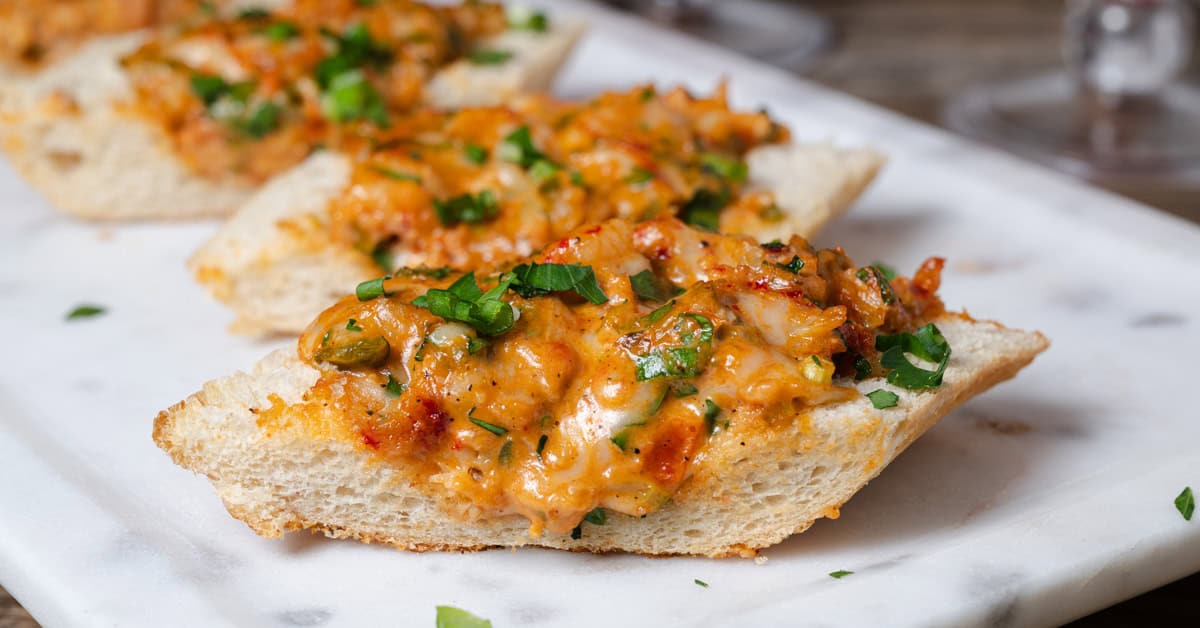 A slice of cheesy Louisiana crawfish bread.