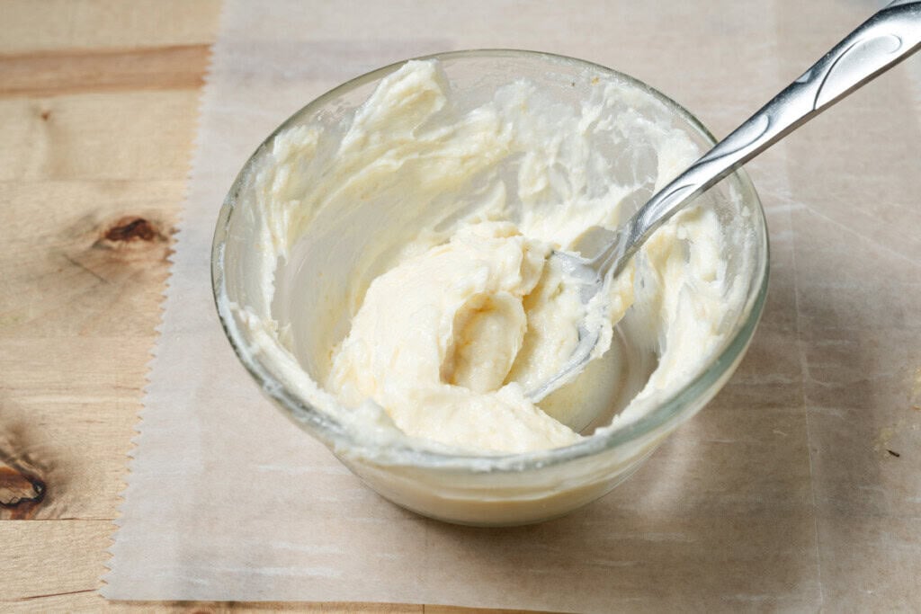 A bowl of garlic butter spread.