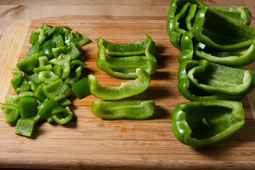 Cutting bell peppers for soup.