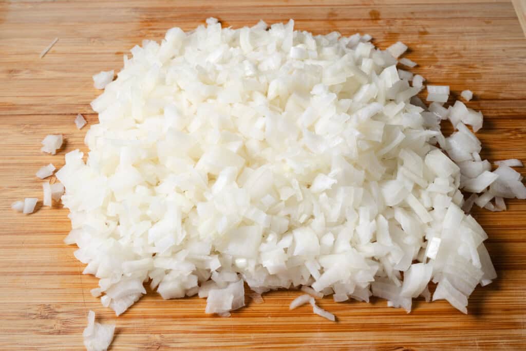 Minced onions for stuffed pepper soup.