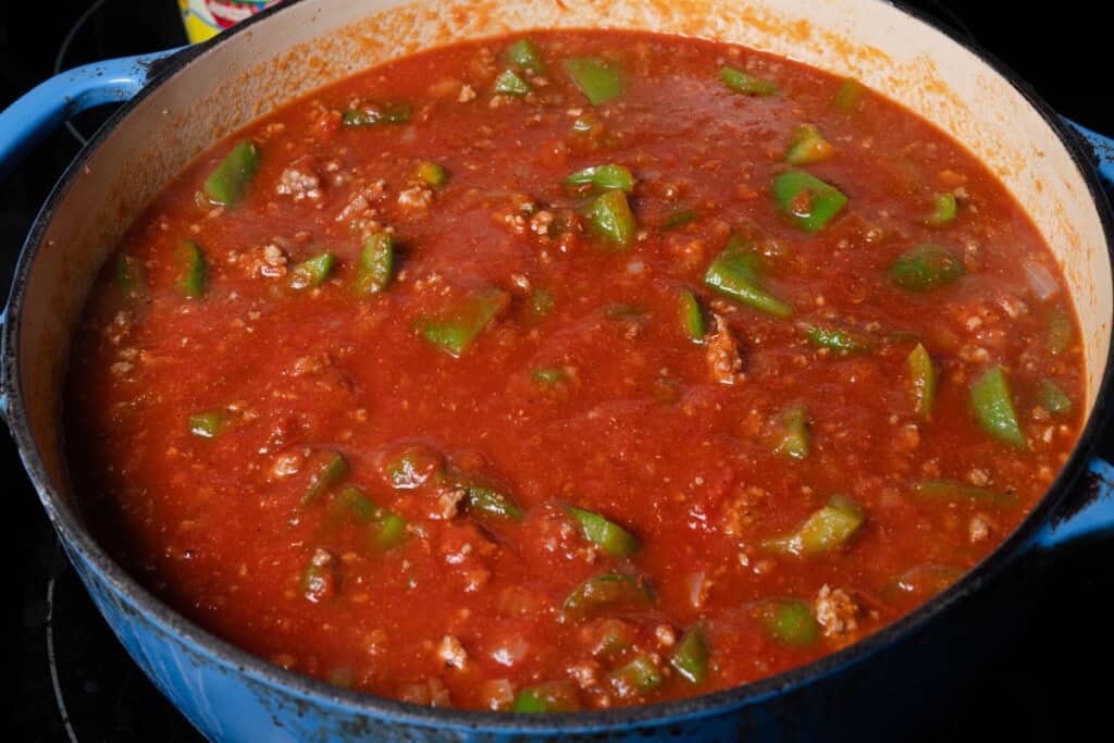 Bringing stuffed pepper soup to a simmer.