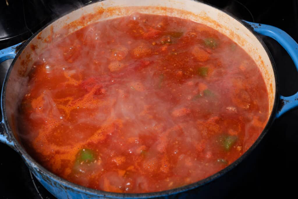 Bringing stuffed pepper soup to a simmer.