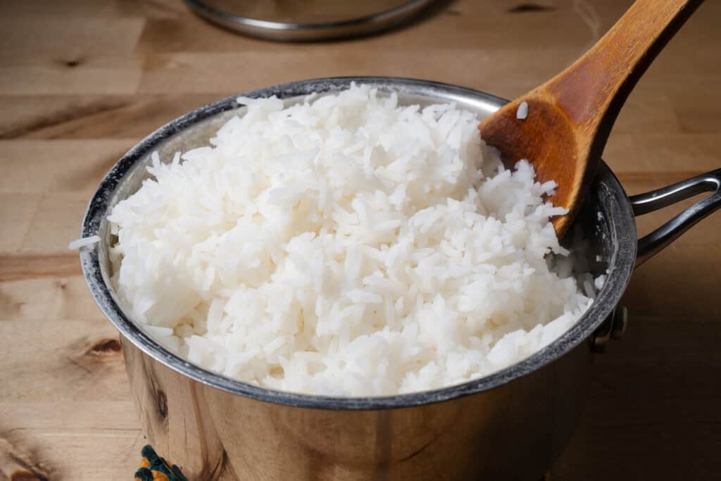 Fluffy cooked white rice in a pot.
