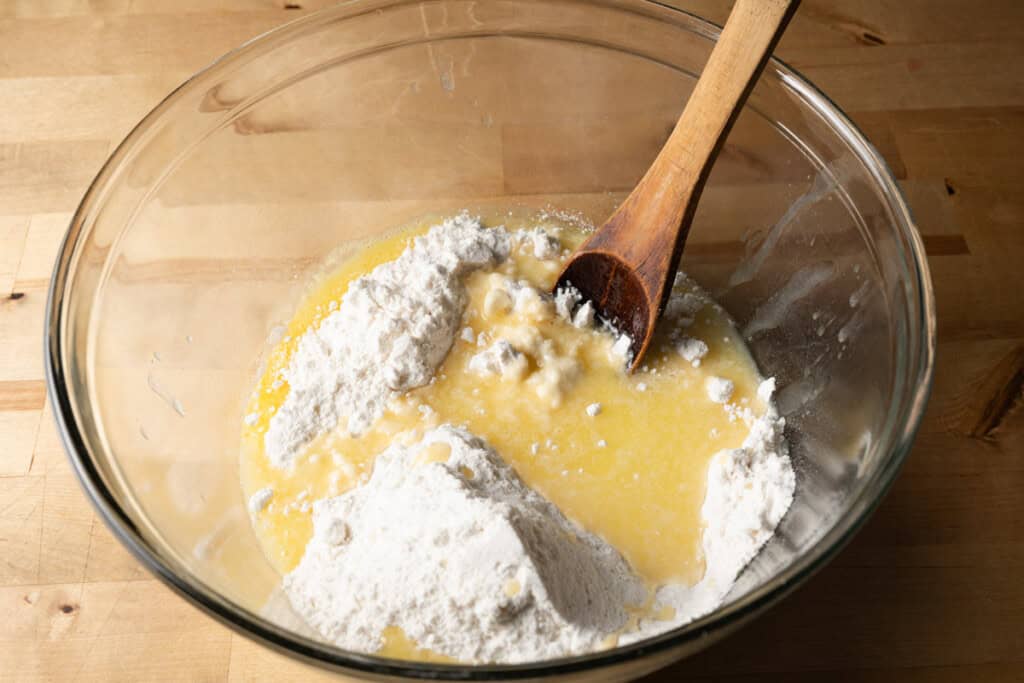 Mixing cake mix, melted butter, and egg in a mixing bowl.