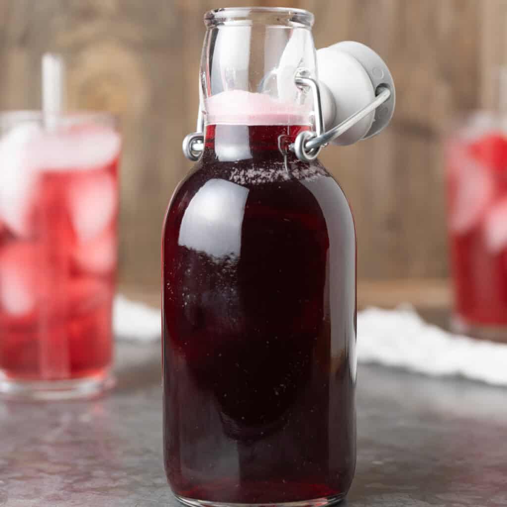 A bottle of homemade grenadine syrup.