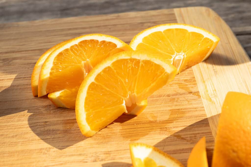 Sliced oranges for cocktail garnish.